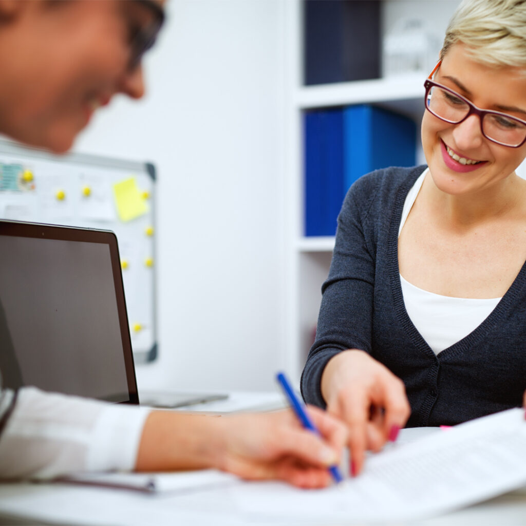 Two adults reviewing paperwork