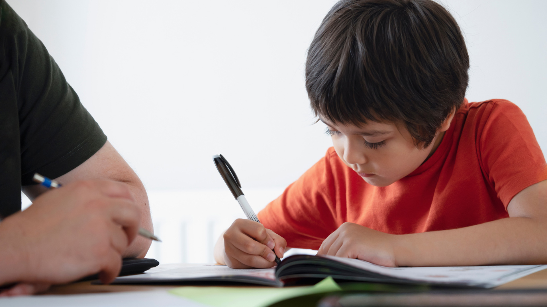 An elementary student is taking a test.