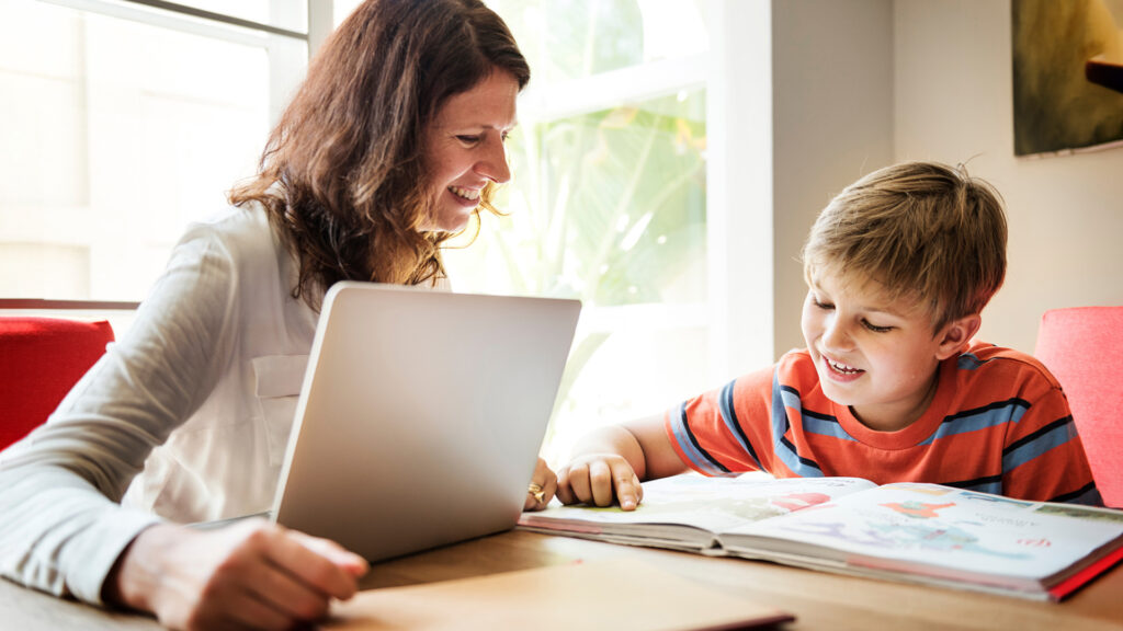 A dyslexia Instructor works with a student on a lesson plan