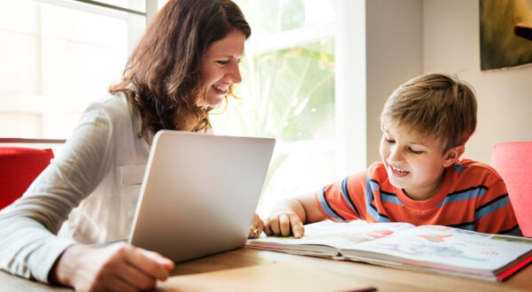 A dyslexia Instructor works with a student on a lesson plan