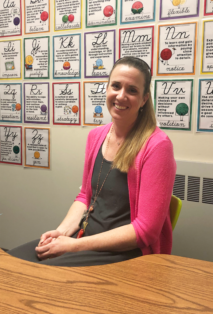 Teacher, Hillary Paquette smiling at camera