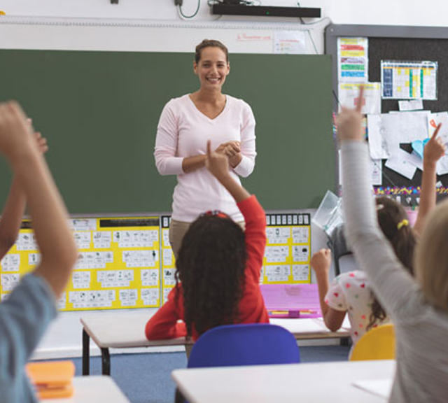 teacher in front of a class of students