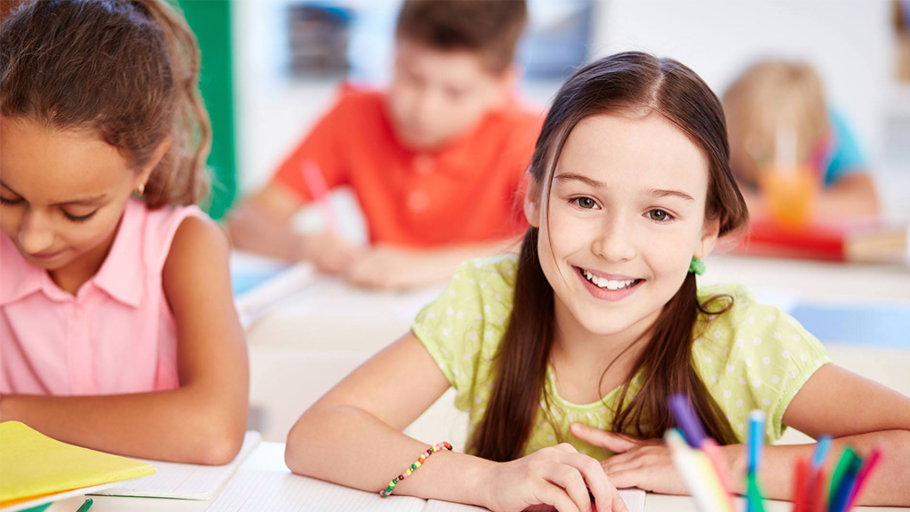 girls smiling in classroom